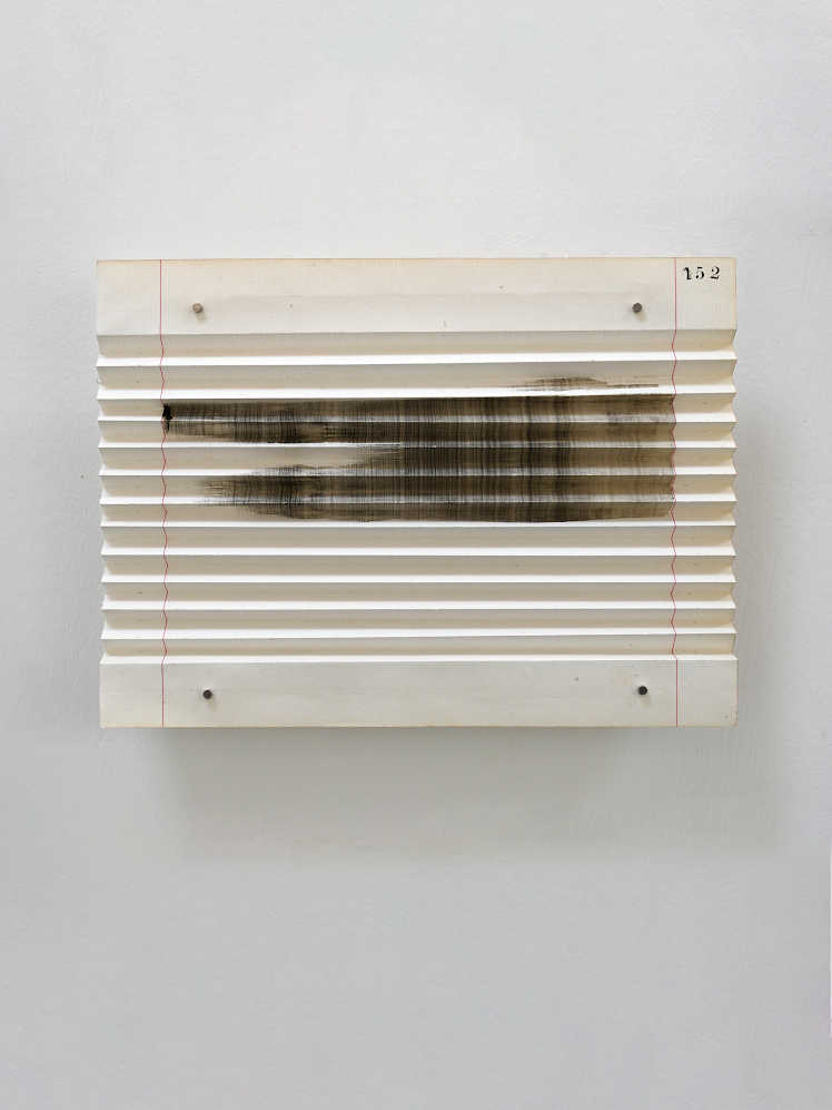An abstract artwork drawn across a folded, ruled sheet of paper.